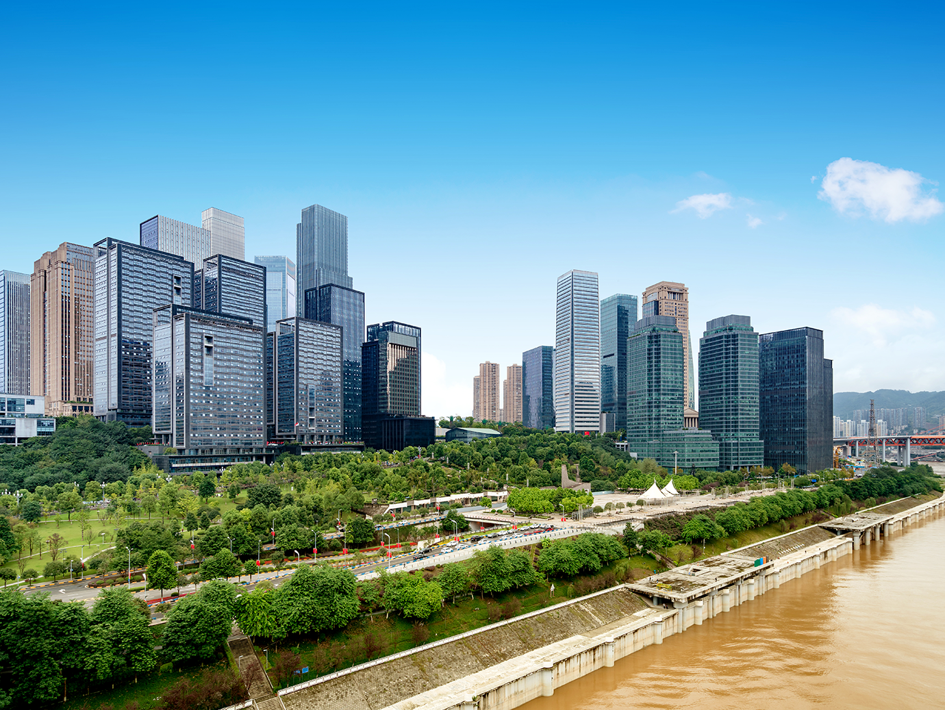 A city skyline along a river during the day