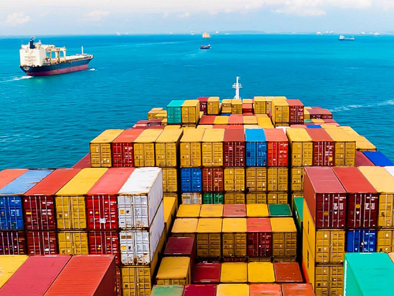 A fleet of cargo ships sailing on a sea