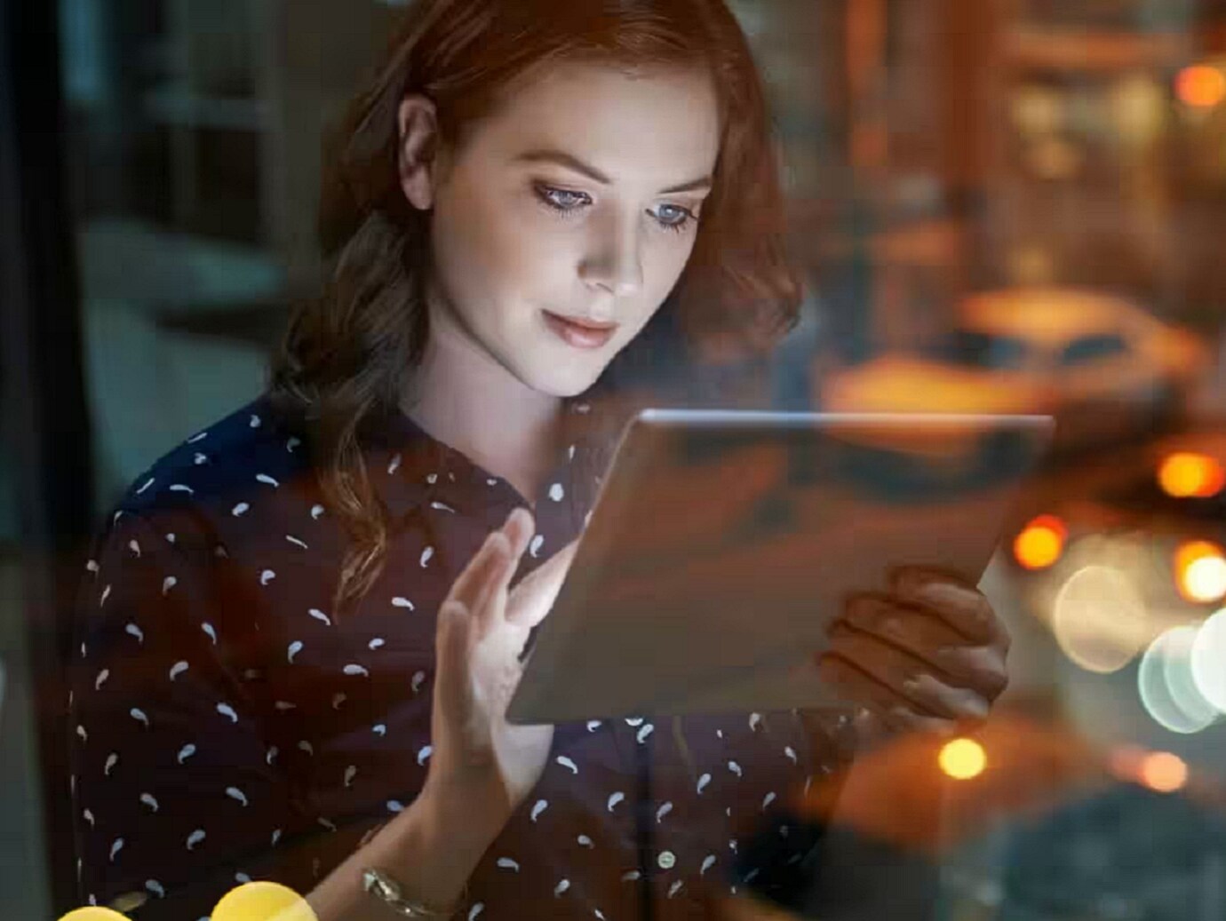 A woman working on her tablet PC
