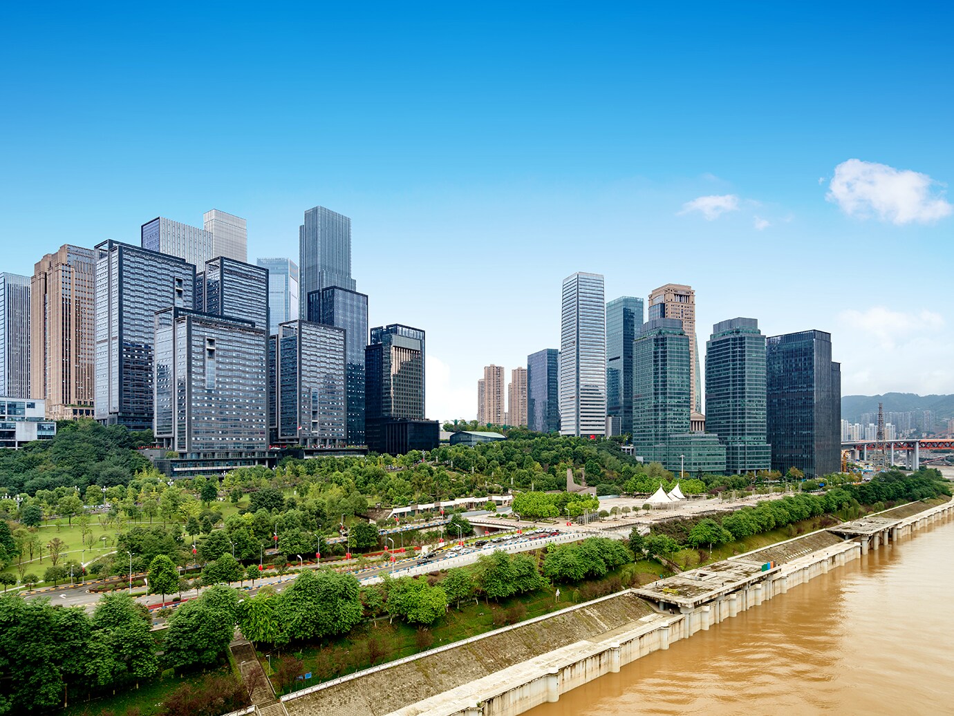 A city skyline along a river during the day