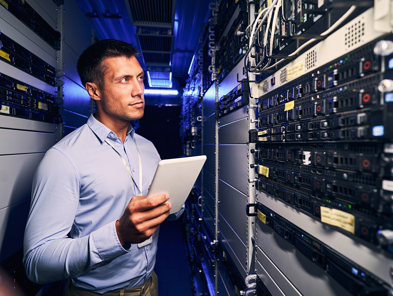 An employee looking at the data servers