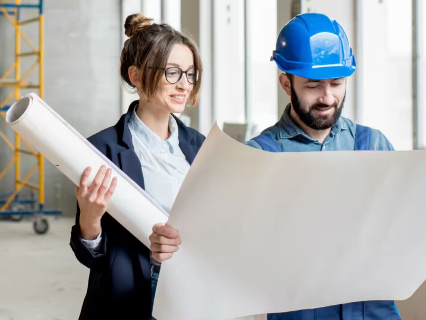 Two workers looking at chart