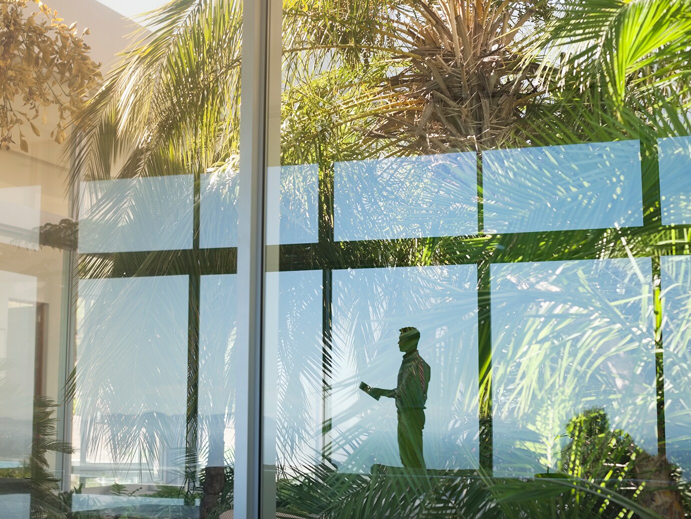 Reflection of a man in a glass window